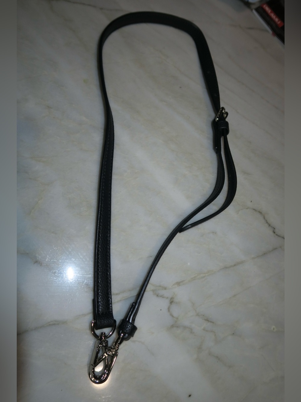 LV handbag strap.